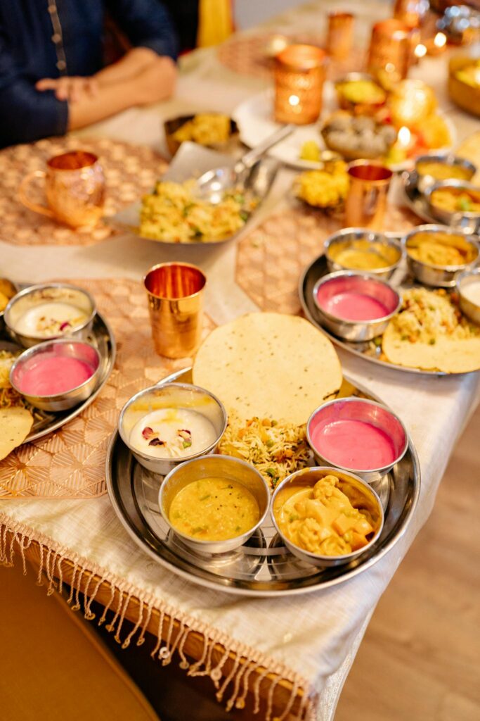 A vibrant spread of traditional Indian dishes on a festive dinner table.