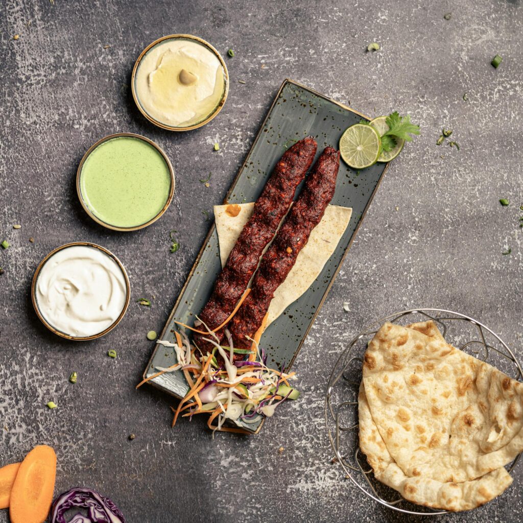 Delicious Middle Eastern kebab platter with dips and bread, perfect for food photography.